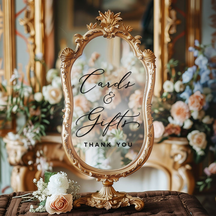 a decorative mirror with a sign that reads "Cards & Gifts Thank You" in an ornate frame.