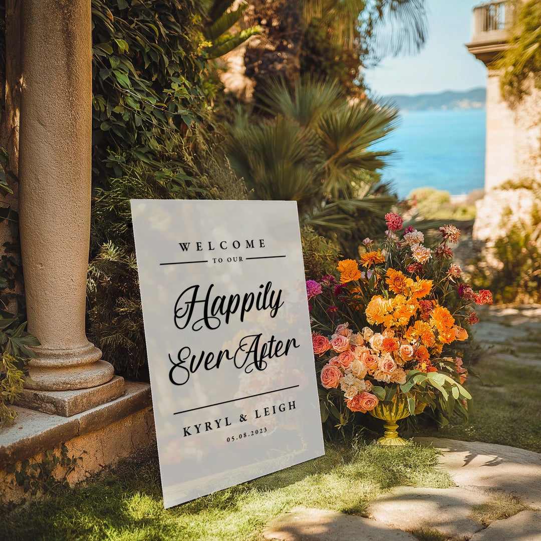 a welcome sign in front of some flowers