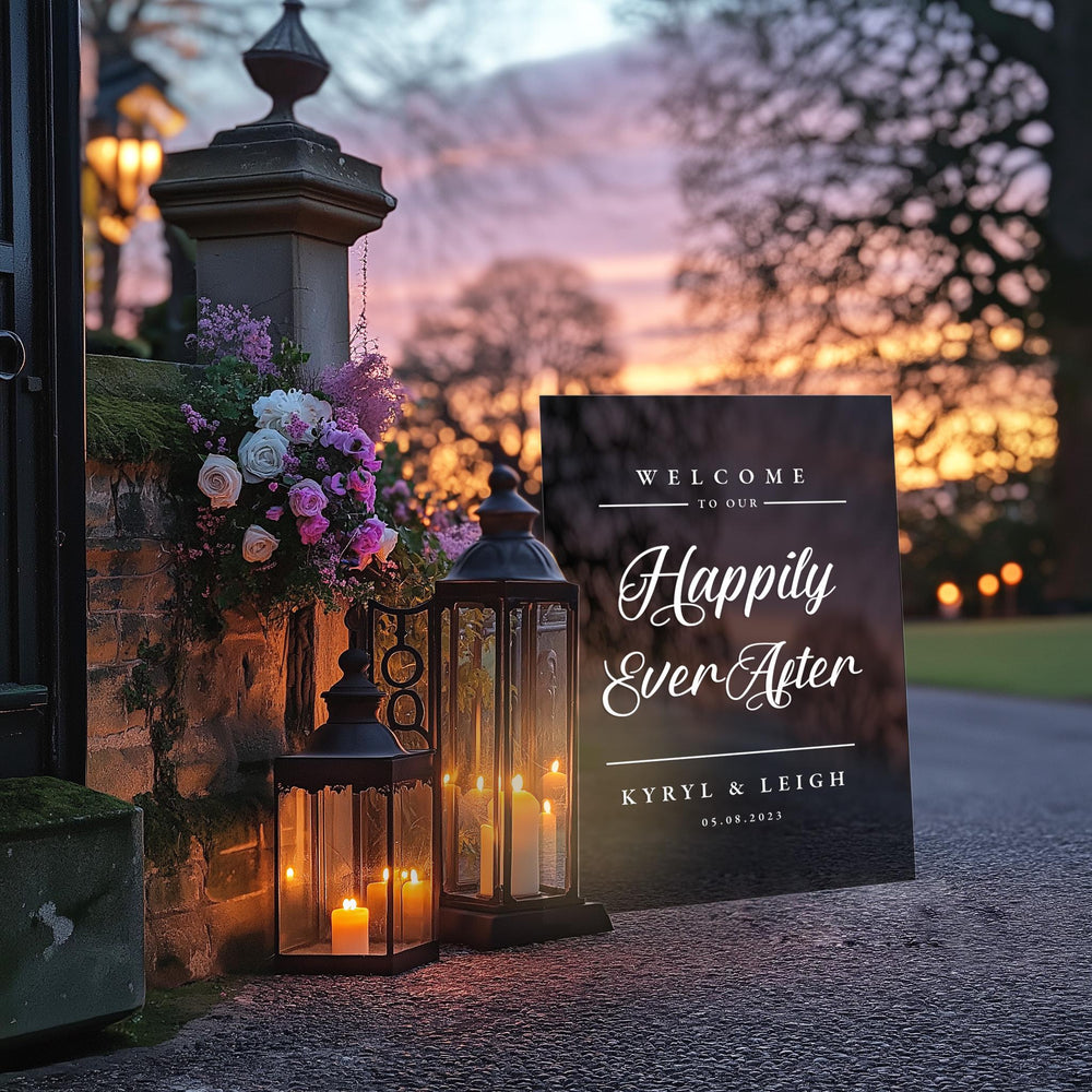 a couple of lanterns sitting next to a welcome sign