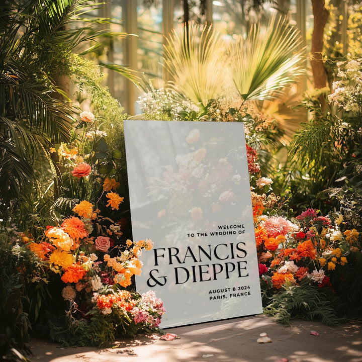 a sign in front of a bunch of flowers