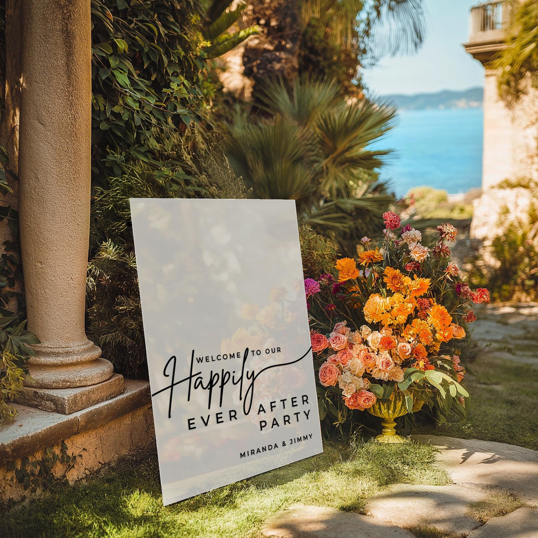 a sign that says happy ever after party next to flowers