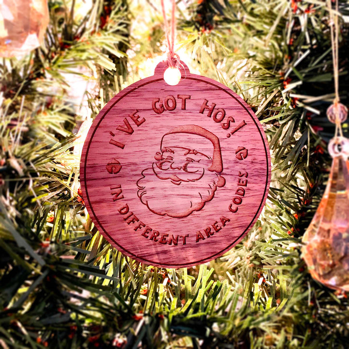 Engraved Christmas Tree Ornament - Cheeky Santa's 'Hos in Area Codes'