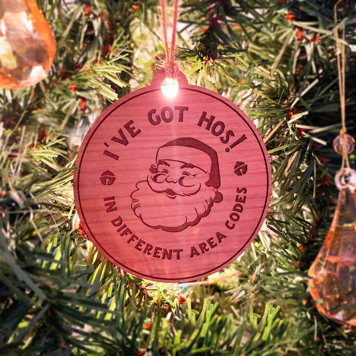 Engraved Christmas Tree Ornament - Cheeky Santa's 'Hos in Area Codes'