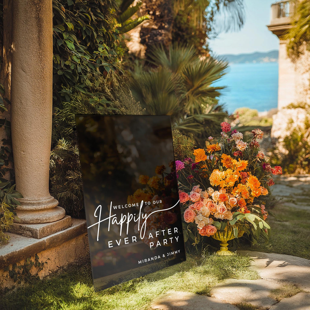 a sign that says happy every water party next to a vase of flowers