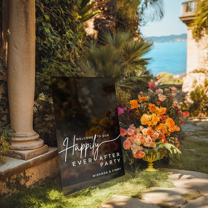 a sign that says happy every water party next to a vase of flowers